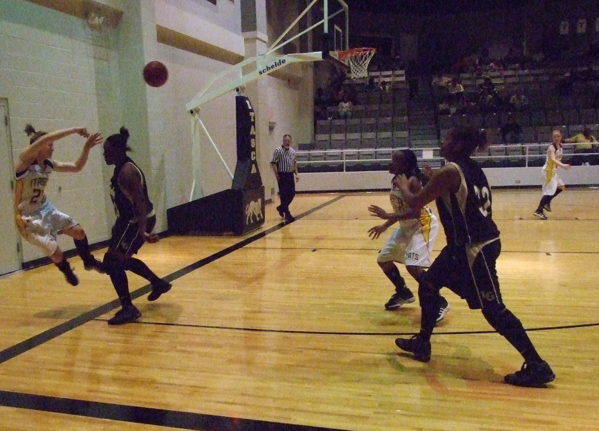 Image: Lady Cat — Italy’s Big Dawg #40 Jimesha Reed scares the “you know what” out of a Lady Cat as she tries to save the ball from going out of bounds.