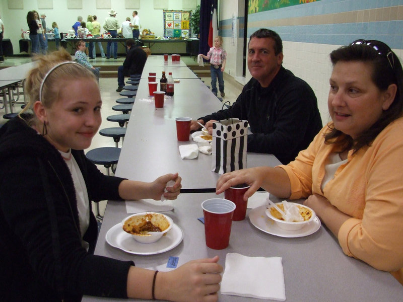 Image: The Lewis Family — Jaclynn, Kelly and Russ Lewis are enjoying the chili dinner.