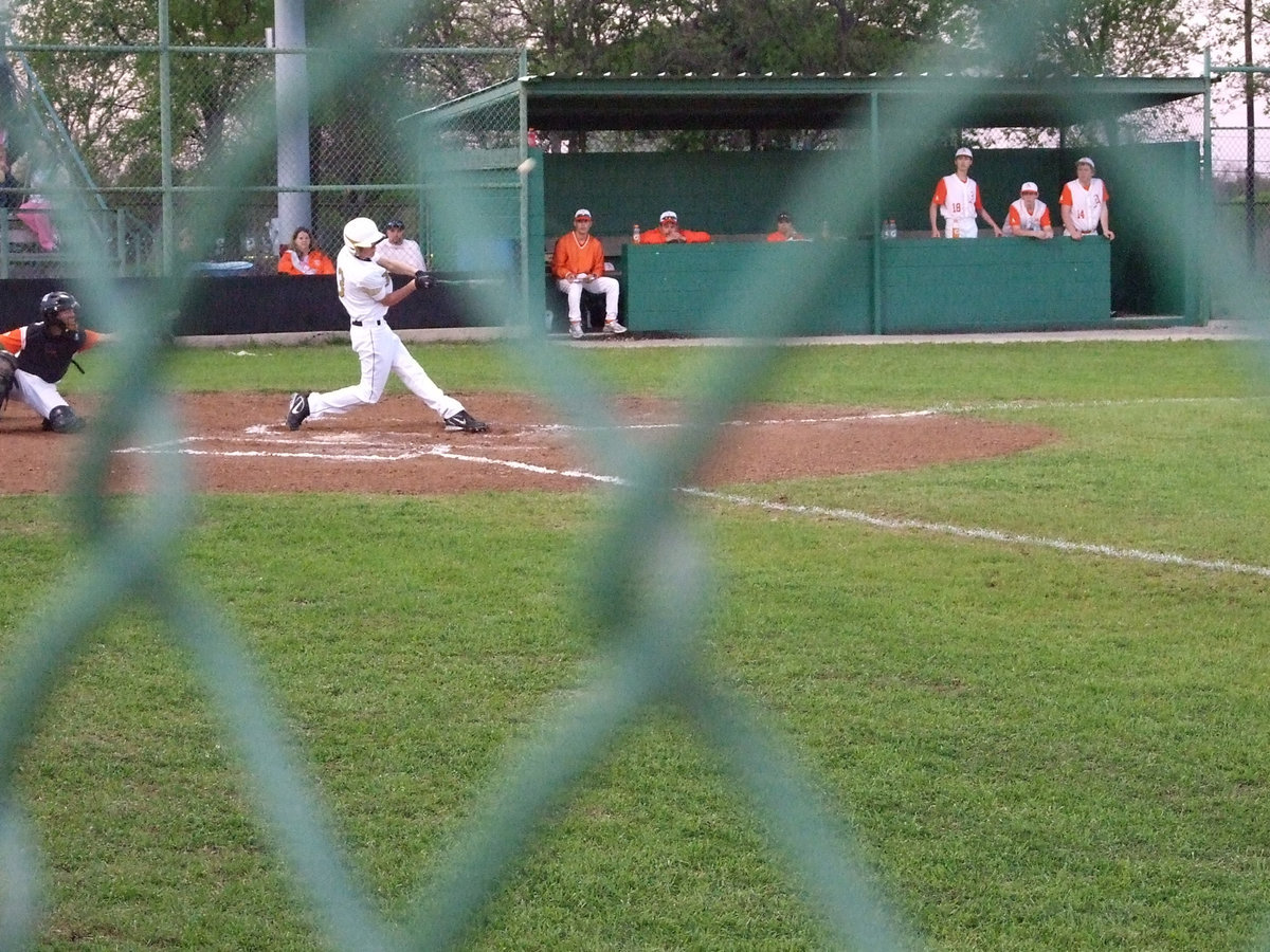 Image: Buck hits us one — Freshman Justin Buchanan hit a single and brought in Jase Holden.