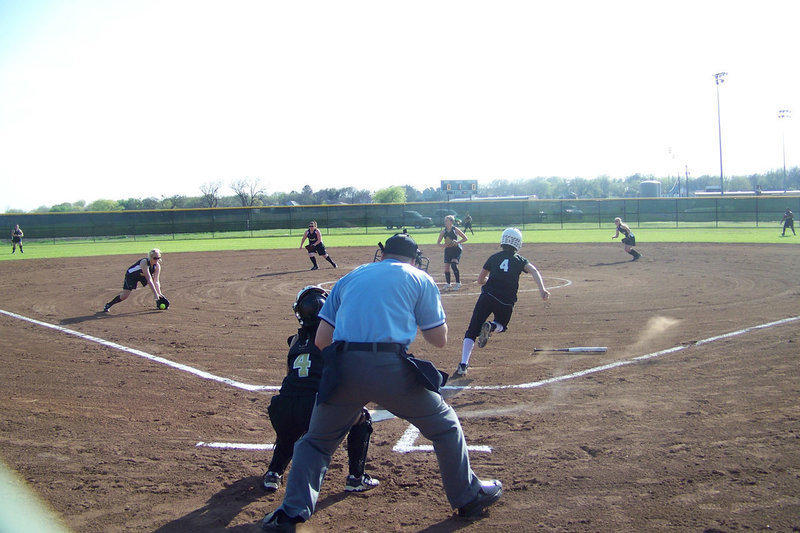 Image: Megan gets a mitt on it — 3rd Baseman, Megan Richards, fields a bunt against the Grandview Lady Zebras.