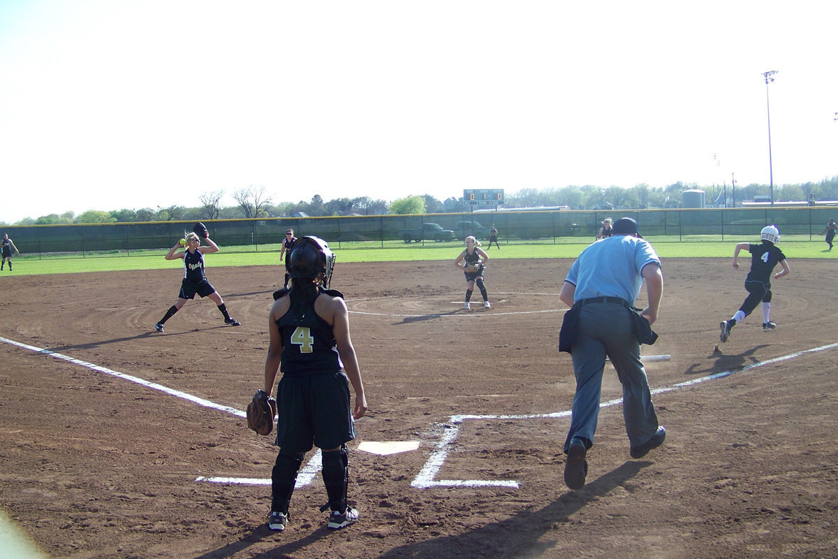 Image: Megan is in time — Megan Richards makes the throw to 1st base for the out.