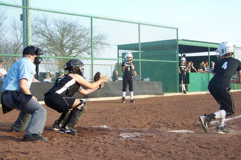 Image: Megan catches — Megan Richards performed well in her first attempt behind the plate this season.