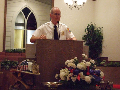 Image: Rev. Dabney — Rev. Ronnie Dabney opened the service with prayer.