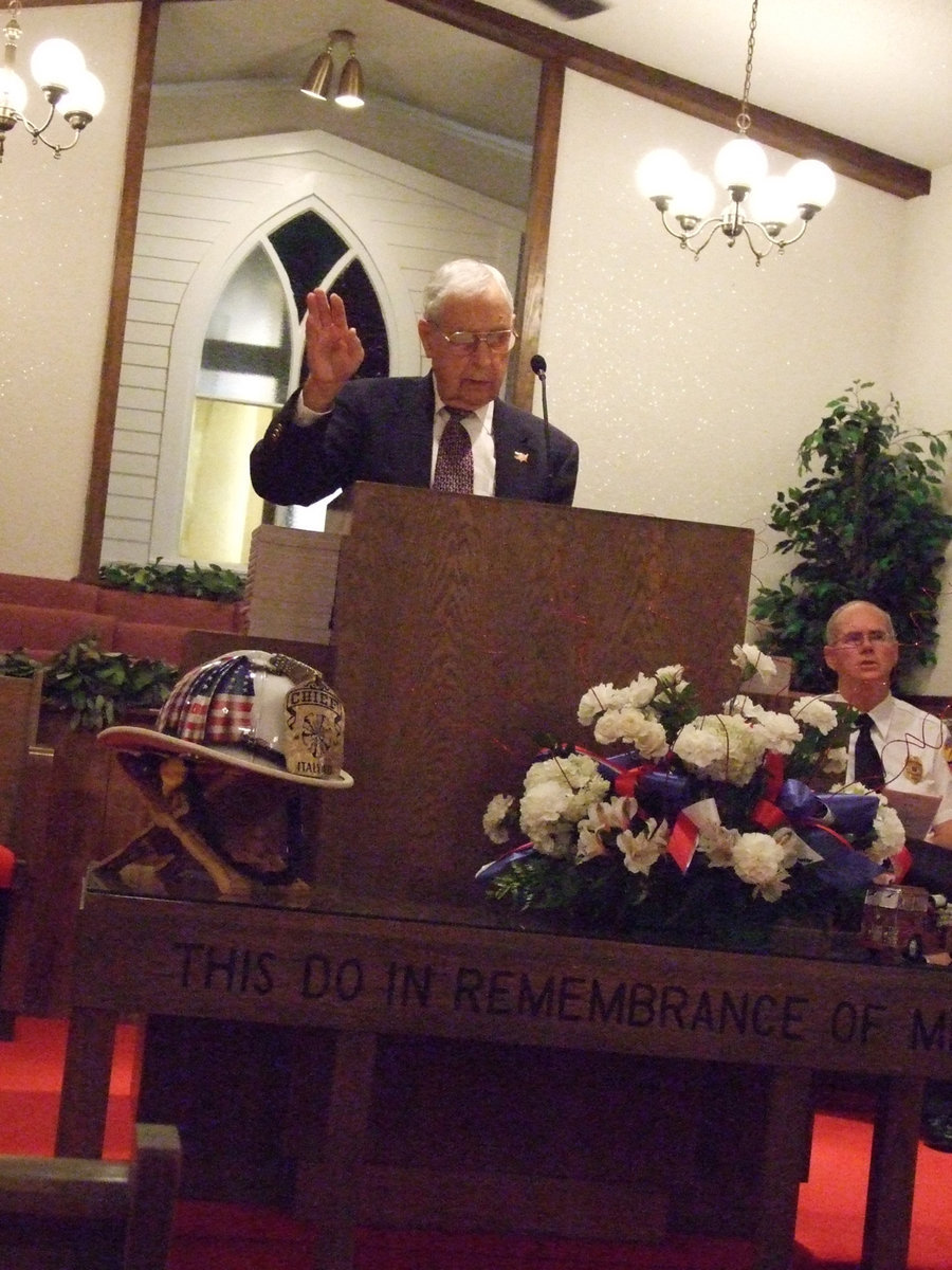 Image: Joe Bradley leads us in singing — Joe Bradley leads in a chorus of “Star Spangled Banner”.