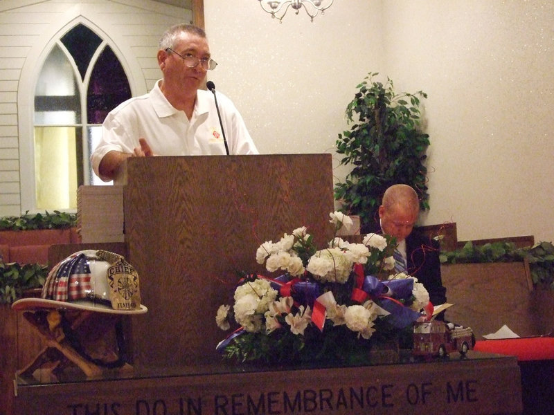 Image: Chief Chambers — Chief Don Chambers calls the firemen to the front for a presentation.