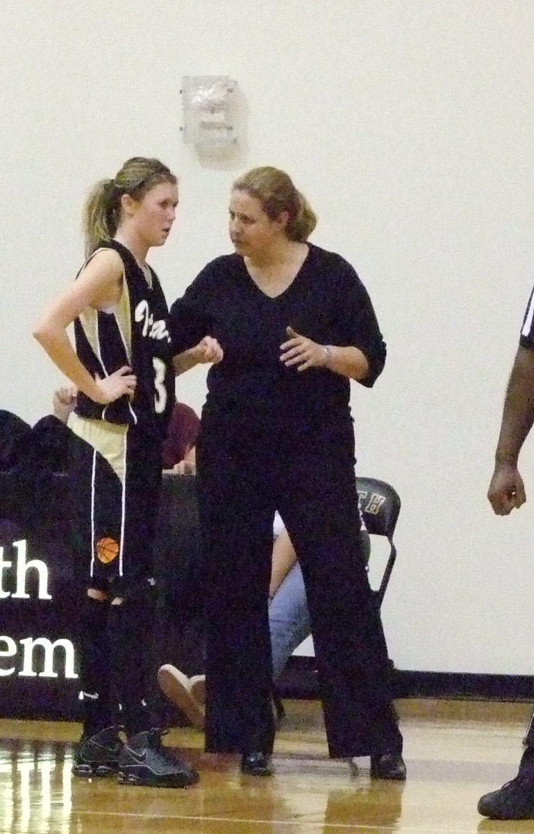 Image: Coach McDonald and Rossa — Coach gives Kaitlyn some instructions for the game.