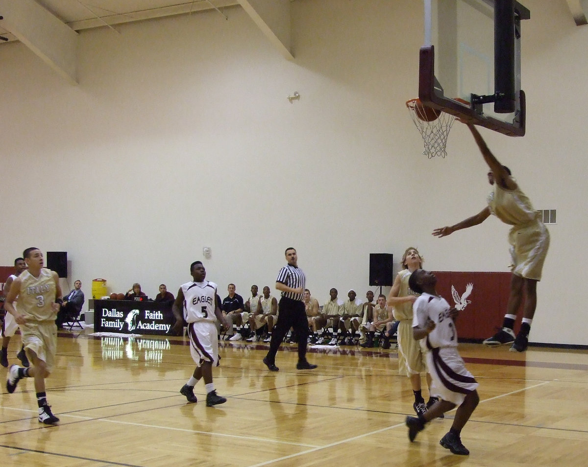 Image: D-Man hangs from the rim