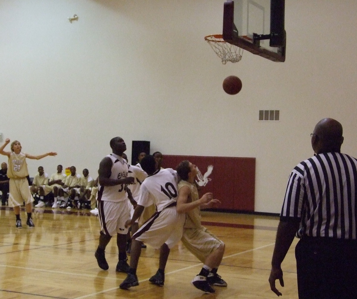 Image: Donald Walton — Donald shoots the ball and despite the Eagle defense, scored 3!