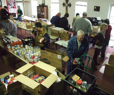 Image: Lots of groceries — The local participants of the Food Pantry received various veggies, fruits and canned meats.