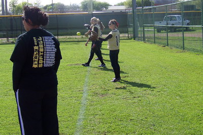 Image: Coach Richards — Assistant Coach Tina Richards oversees the throwing warm-ups.