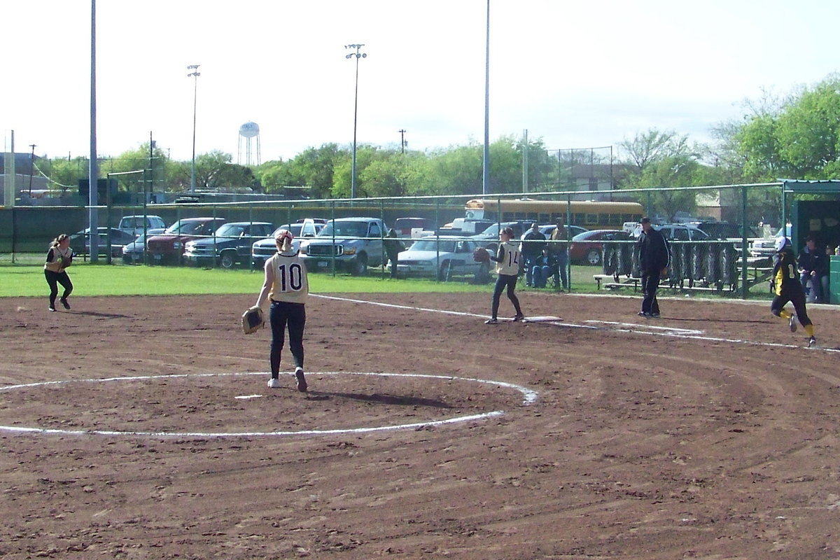 Image: Routine Grounder — Cori Jeffords takes a routine grounder….