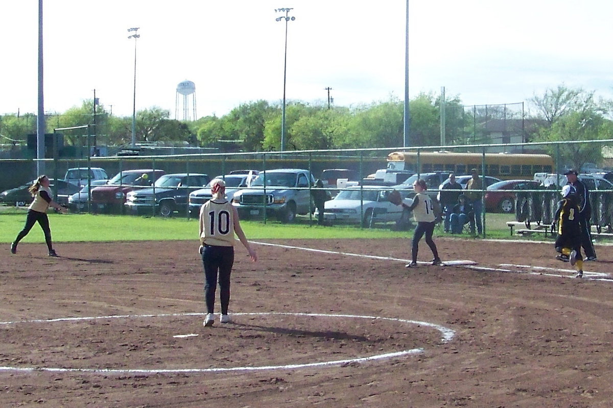 Image: Routine Throw — …and makes the routine throw to Windham at first base for the “routine out.”