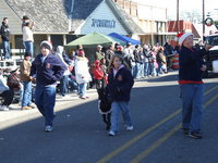 Image: 2009 Italy Christmas Festival — Italy Junior FFA members, Austin and Aaron Pittmon and Jill Varner leading “Cookie”, stroll thru downtown Italy as participants in the 2009 Italy Christmas Festival Parade.