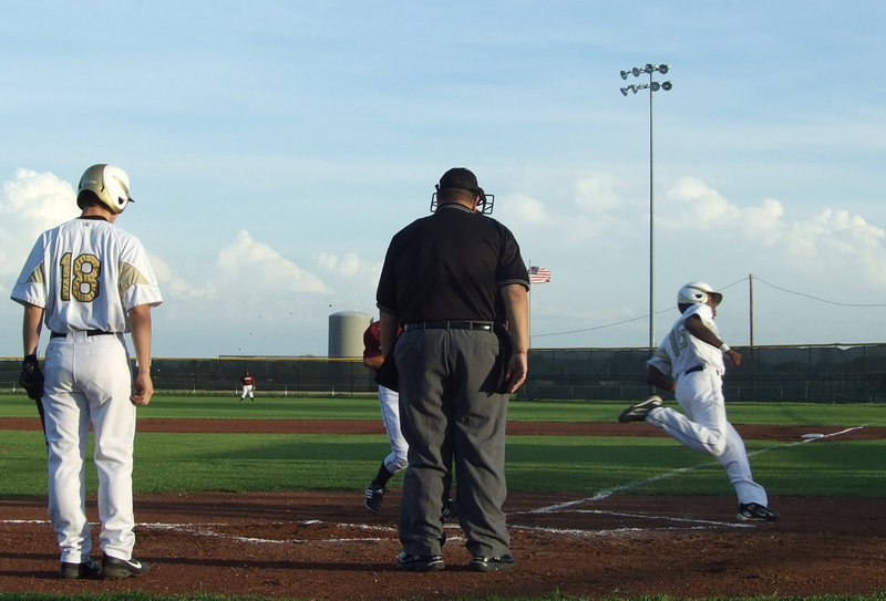 Image: Another run — Kyle Wilkins steps aside while Desmond Anderson scores one more.