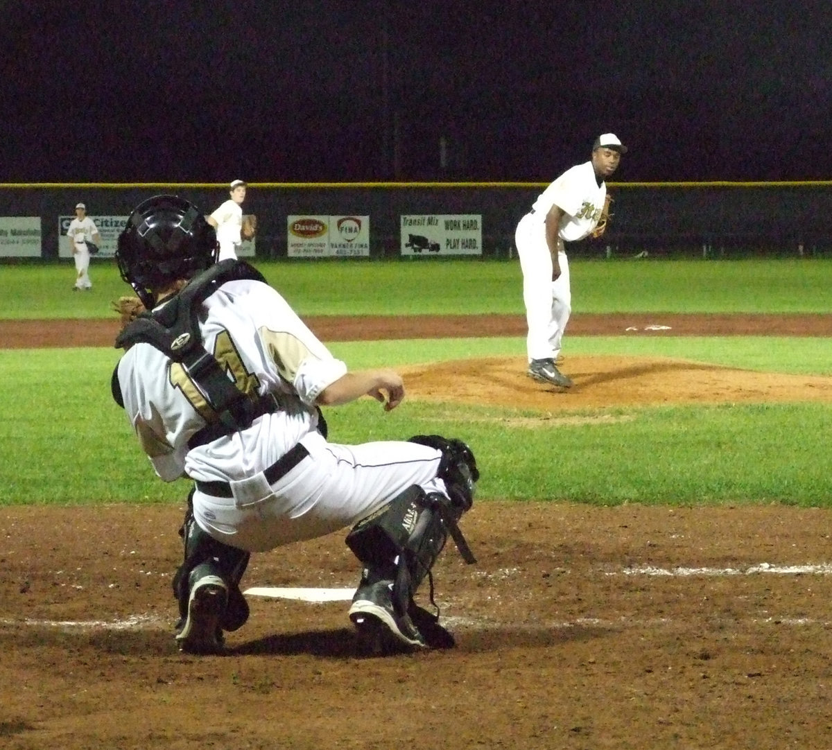 Image: Jasenio warms up — Jasenio Anderson and Colten Campbell warm up in the top of the fourth.