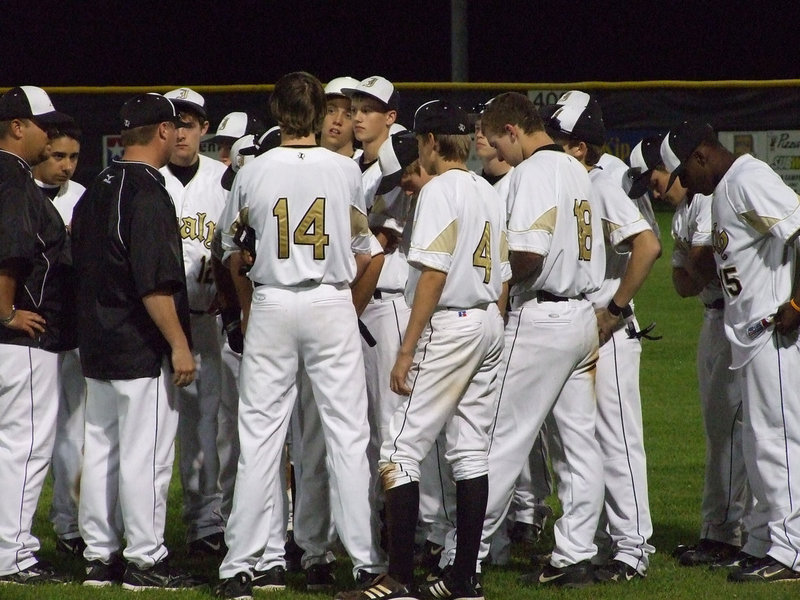 Image: Victory speech — In the round up after the game, Coaches Ward and Coker gives the boys some tips for the upcoming game.