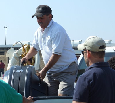 Image: Roadies — Italy ISD School Board vice-president, Larry Eubank and parent, Doug Nelson helped with unloading the equipment.