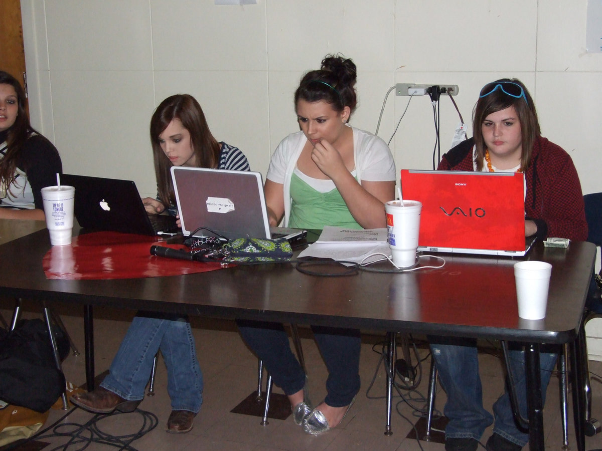 Image: Deejays search for the perfect song — Drew Windham, Molly Haight and Meredith Brommett search the net for the perfect songs.