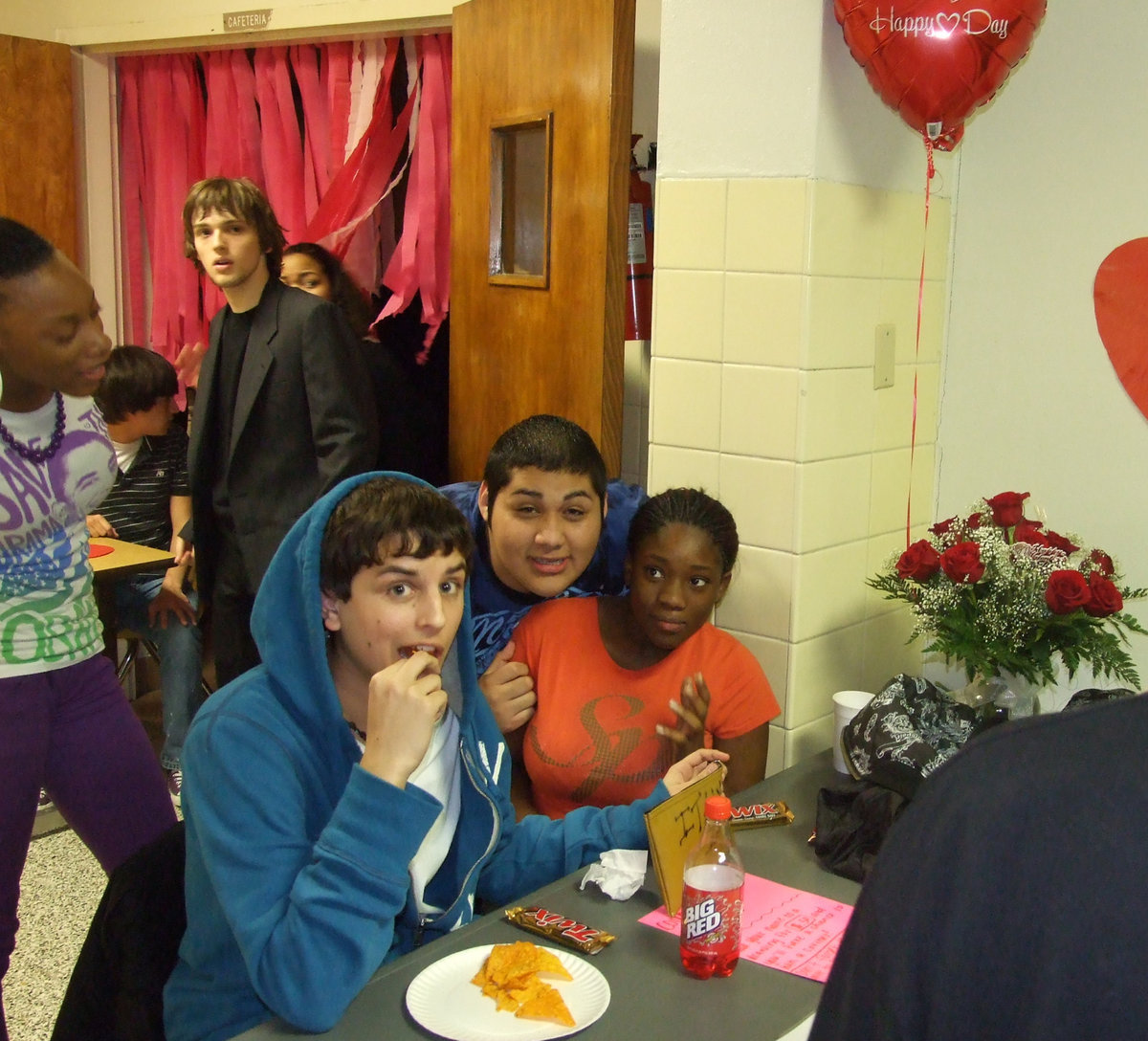 Image: The table crew — Bryan Michaels, Alonzo Ayala and Shadarin Jones take money at the door for the dance.