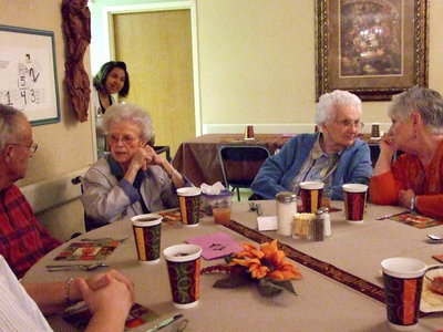 Image: Lots of Conversation — These residents and family are having fun catching up.