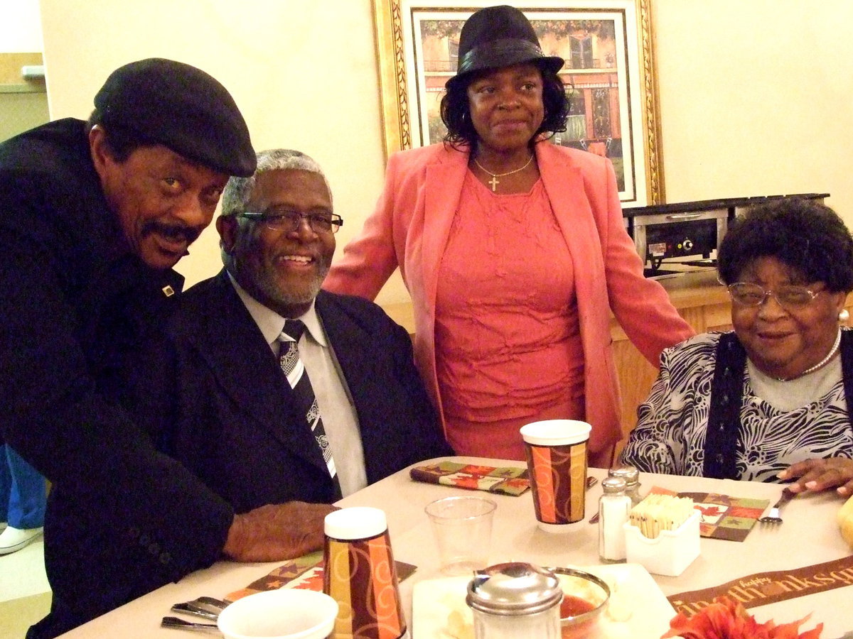 Image: Walter, Wayne, Mavis and Joanne — Walter Sandifer, Wayne Simpson, and Joanne Sandifer came all decked out to join Mavis Sandifer for Thanksgiving dinner.