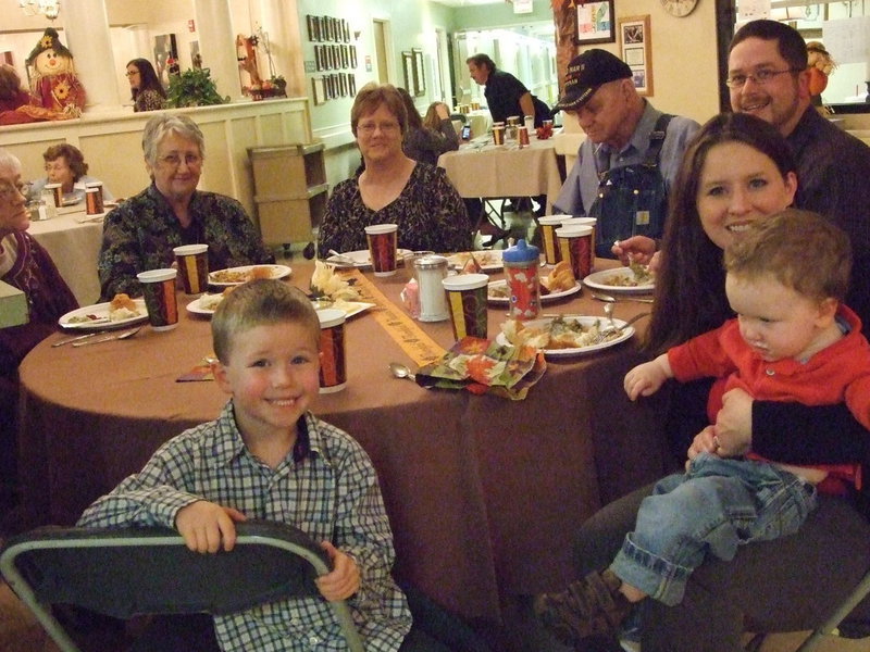 Image: Happy Family Having Fun — These folks were ready to eat and have some fun.