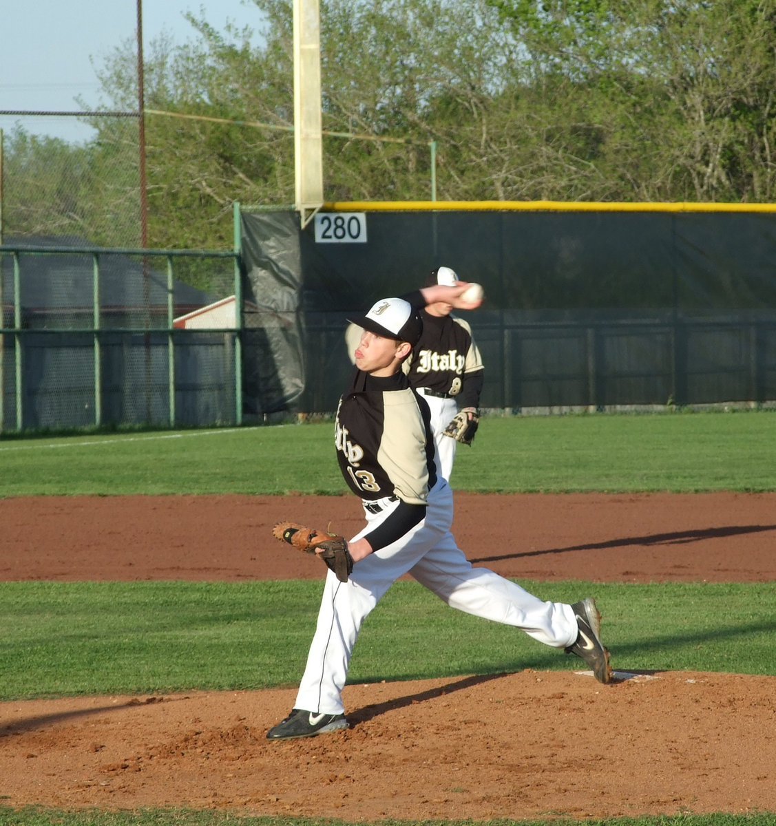 Image: Freshman Justin Buchanan — Even though Justin (“Buck” as the crowd affectionately calls him) has been pitching for years in city league ball, this was his first time to pitch a varsity game for Italy High School. According to Coach Matt Coker, he did very well.  This young man is someone to watch.