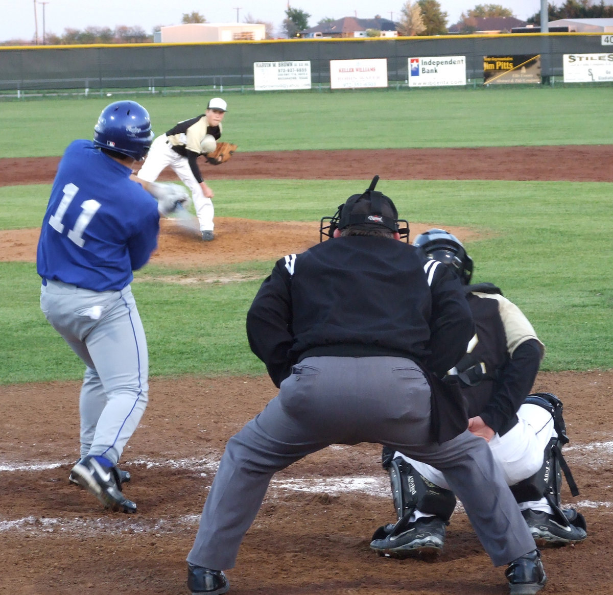 Image: Bringing the heat — Justin pitches to Frost’s #11 Taylor Ellison, center fielder.