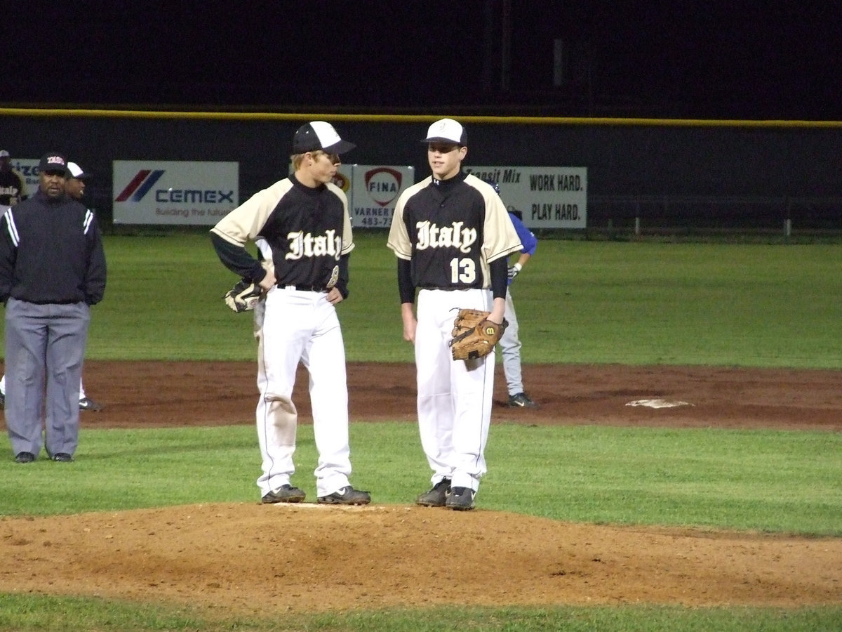 Image: Josh and Buck — Gladiators Josh Milligan and Justin Buchanan discuss the game during a break.