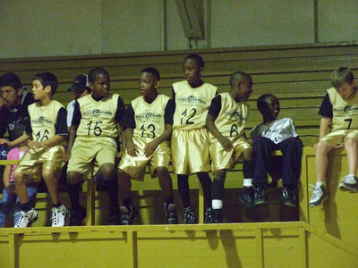 Image: Norwood’s Net Poppers — Coach Ken Norwood’s squad relaxes before their game.