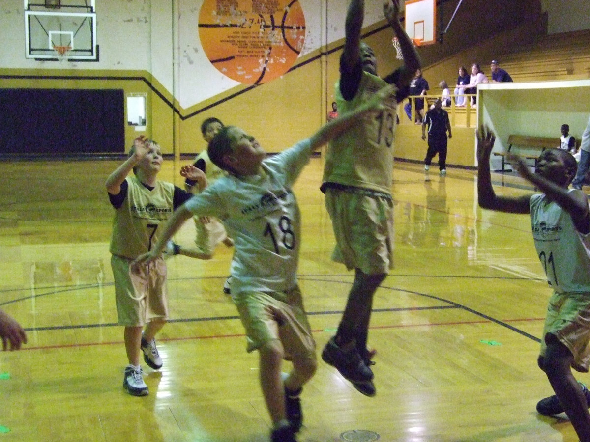 Image: Rising above — Cameron Carter #13 goes up for a shot.