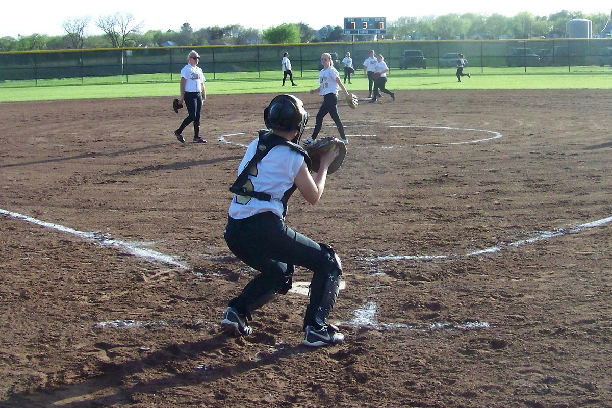 Image: Throw down — Bailey throws down to second base during infield warm-ups between innings.