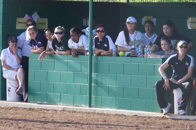 Image: Signals — Coach Reeves gives the pitch signal to Bailey.  Coach Windam gives the “I need a nail file” signal.