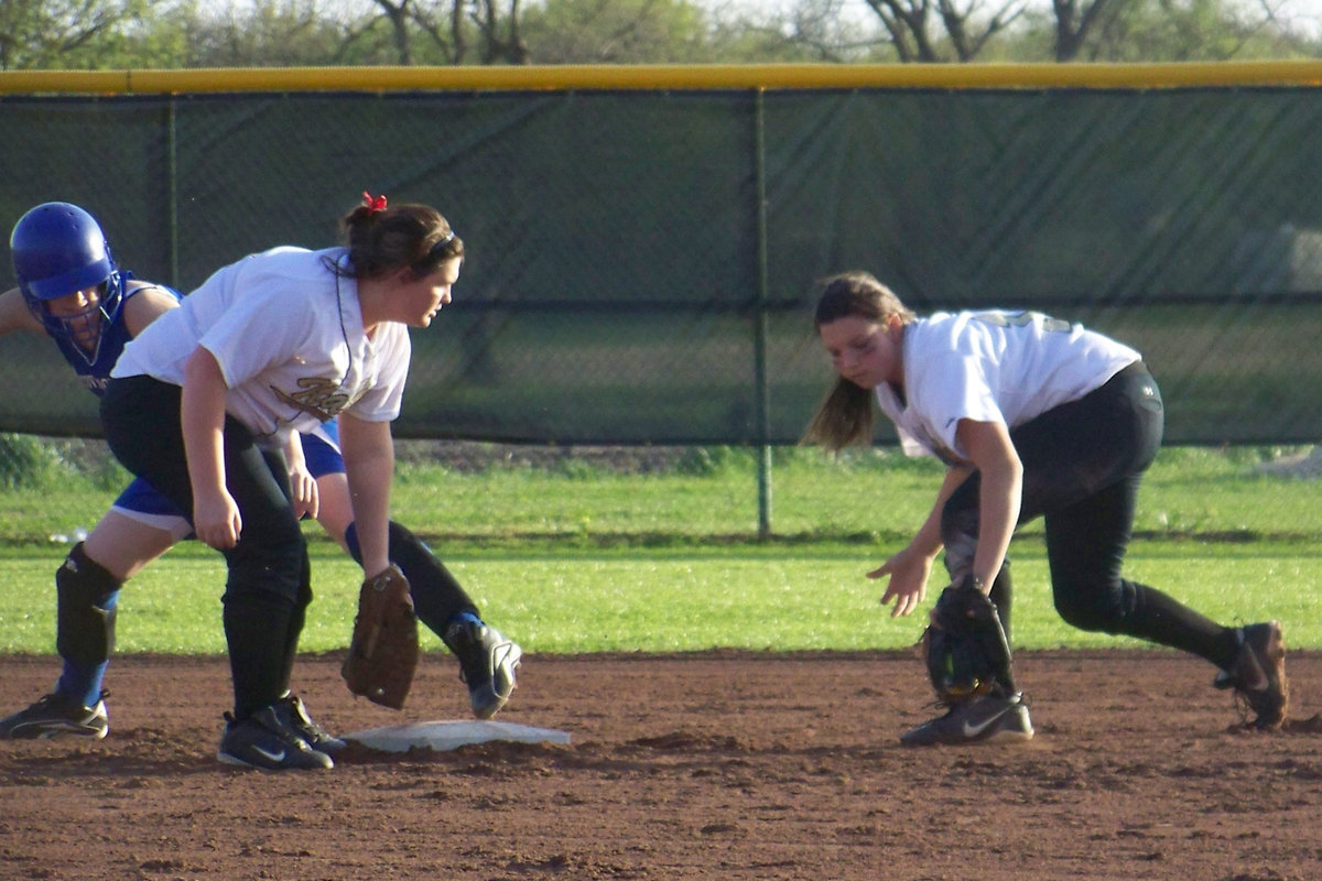 Image: Back handed snag — Cori Jeffords makes a great back handed snag behind second base.