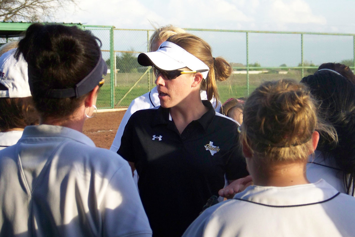 Image: “Keep your head in the game” — Coach Reeves keeps the girls pumped up during the game.