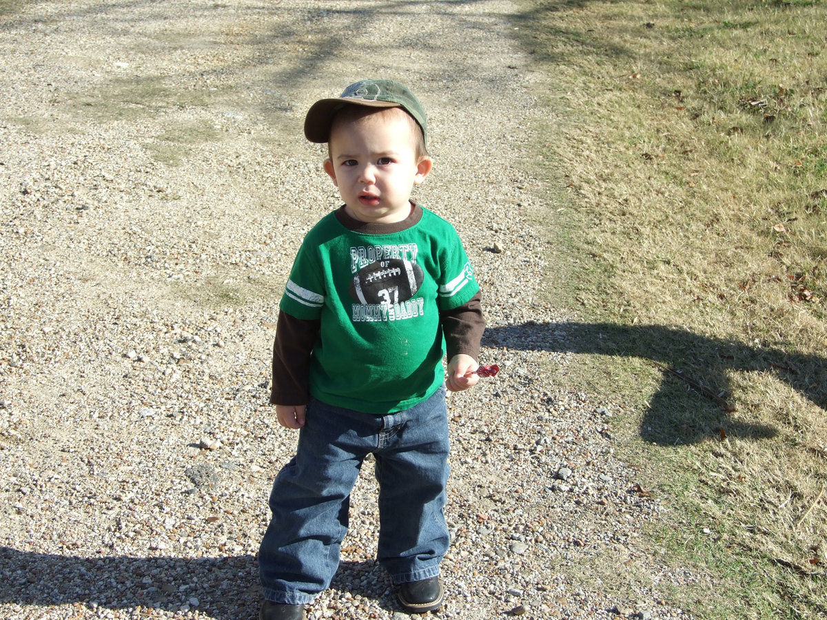 Image: Can I have some more candy? — This young man was ready to grab the next piece of candy tossed his way.