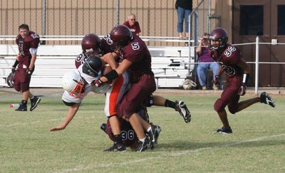 Image: Converging Dogs — Bynum tacklers gang up on Davis.