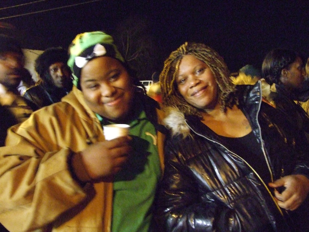 Image: Enjoying the moment — The crowd enjoyed hot chocolate and the children singing during the lighting ceremony.