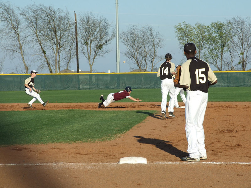 Image: Is He Safe? — An unspecting Eagle gets in between the Gladiators at second and third.