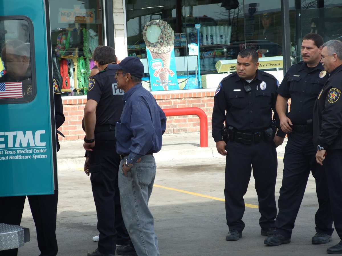 Image: Got Backup? — A man that allegedly was suffering from an accidental overdose was loaded and taken to the hospital as backup officers, including Milford Police Chief Carlos Phoenix (pictured 2nd from right), were ready to assist.