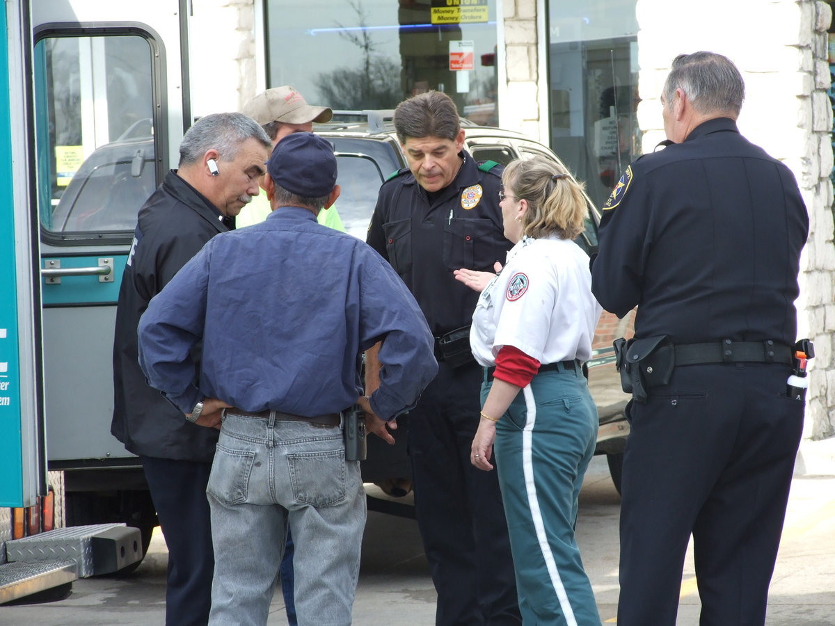 Image: Explanation Of Events — Rescue personnel finalize the details before leaving the scene.