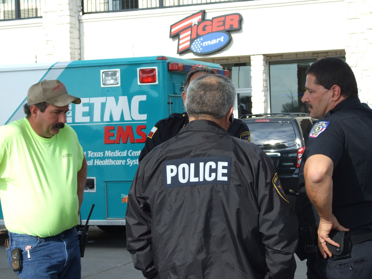 Image: Nice Job — Rescue personnel share notes just before the ambulance leaves for the hospital.