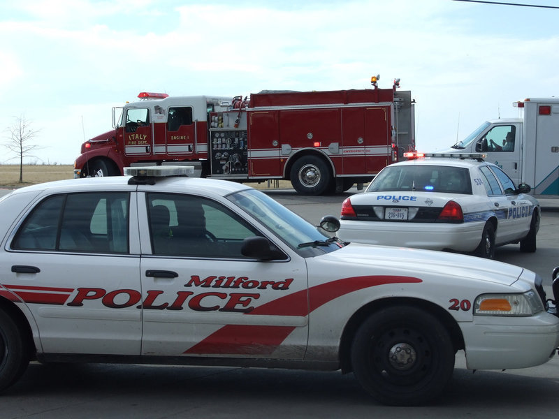 Image: Exiting The Scene — Emergency vehicles caravan back to their posts.