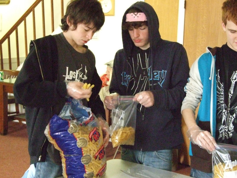Image: Divide Up the Macaroni — Dylan and Zach separate 5lb bags of macaroni into smaller servings.