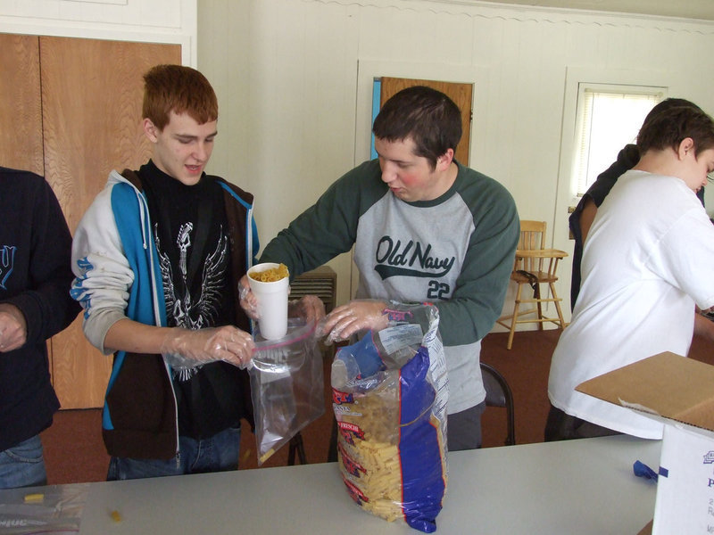 Image: Chris Talleri and Aaron Israel — Talleri teaches the youth that “Love is a Verb”.