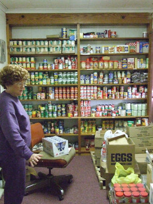 Image: Mayme Helps in the Food Pantry — Mayme Onstad helps in the food pantry for the Italy Ministerial Alliance.