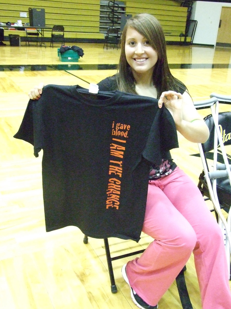 Image: Her new favorite shirt — You get juice, cookies and this really cool shirt.