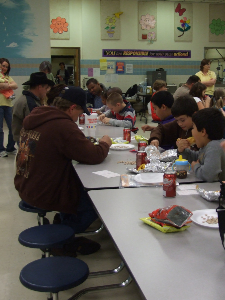 Image: Bingo and Food — Everybody is having fun playing bingo and eating hotdogs.