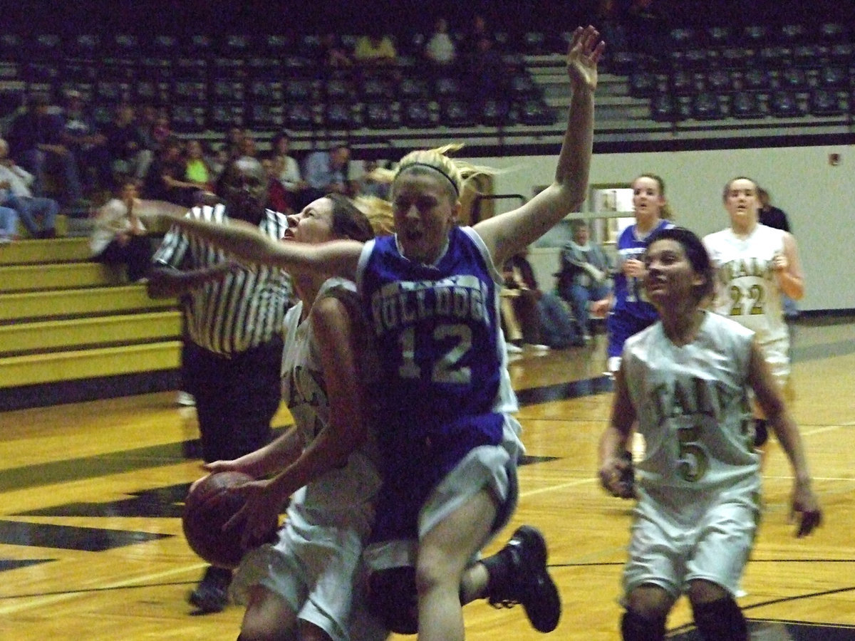 Image: Italy’s JV Girls Take It On The Chin — Italy’s #20 Danielle Baugher takes a hard foul across the chin on her way to the basket against the Rice Lady Bulldogs Saturday at the Italy Coliseum. Italy was handed their 2nd loss of the afternoon by Rice 29-26.