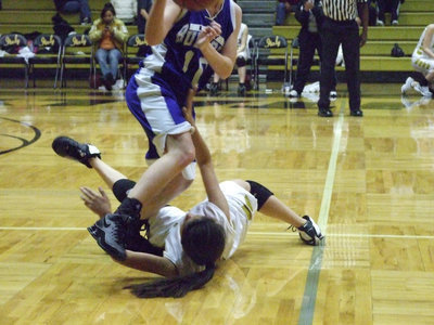 Image: Whatever It Takes — Let this be an example to the young Lady Gladiators out there. Italy’s #12 Alma Suaste is willing to “get dirty” on the hardwood in order to win.